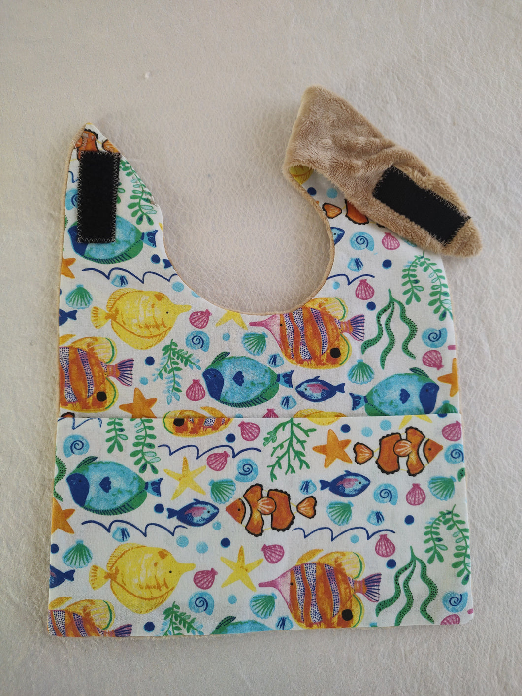 Baby bib with crumb catcher pocket